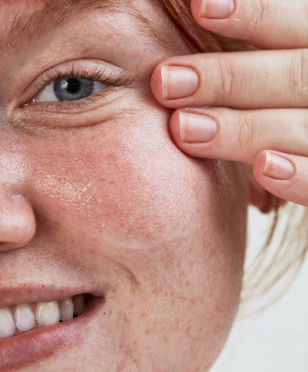 woman applying skincare