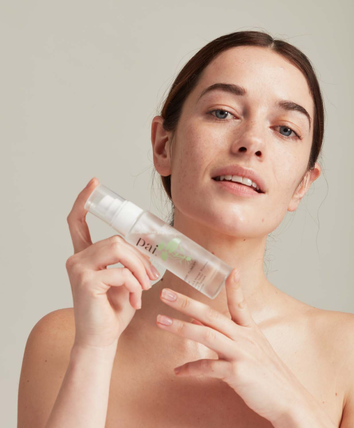 woman holding face mist