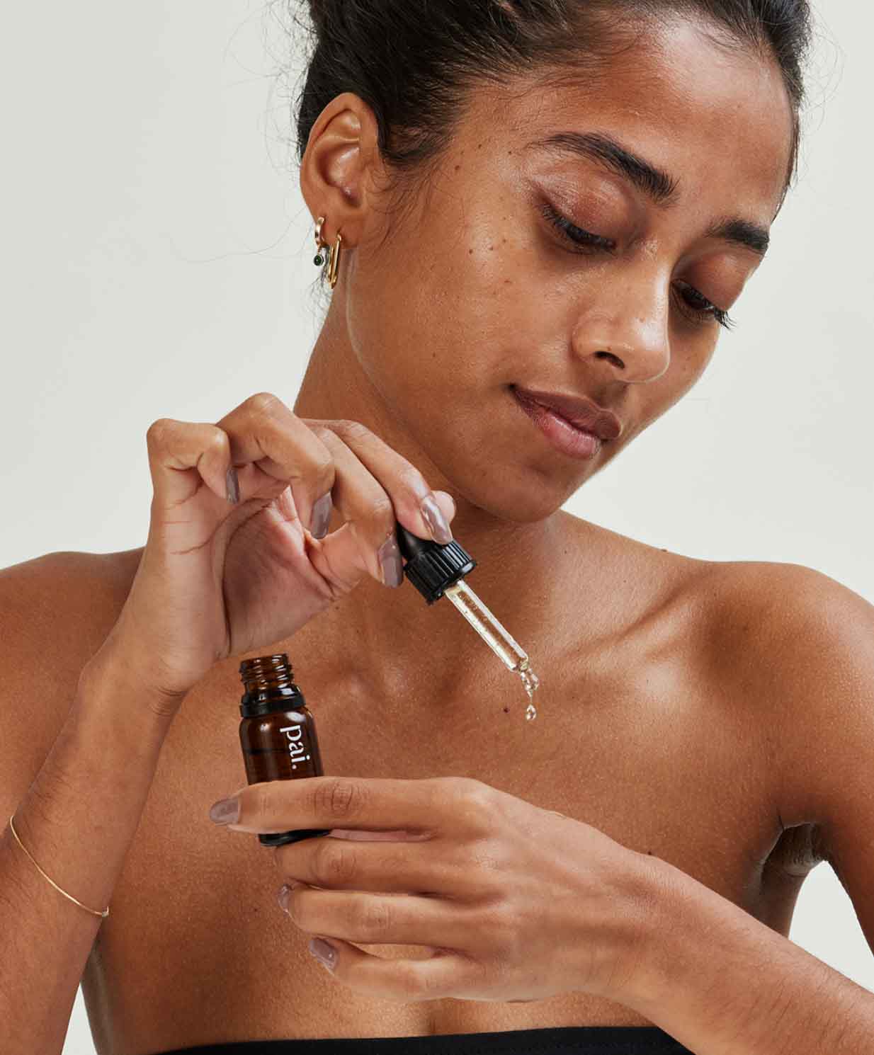 woman applying vitamin c booster